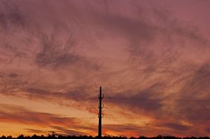 Power pole and evening sky
